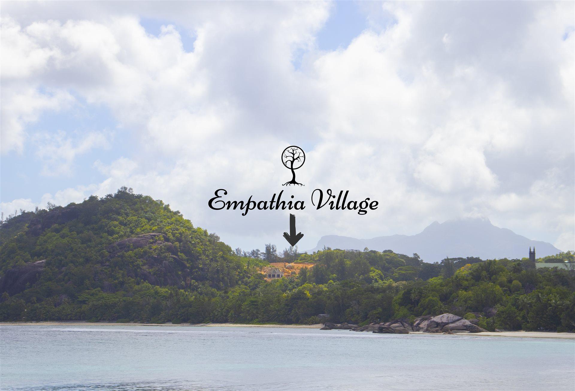 Empathia Village hillside seen from the ocean